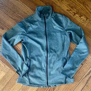 Nike Women's Dri-FIT full-zip running jacket in gray.
